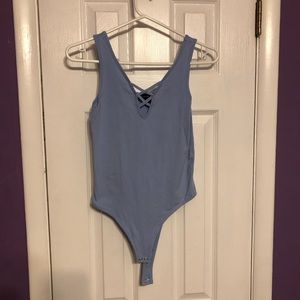 Sleeveless bodysuit with criss-cross